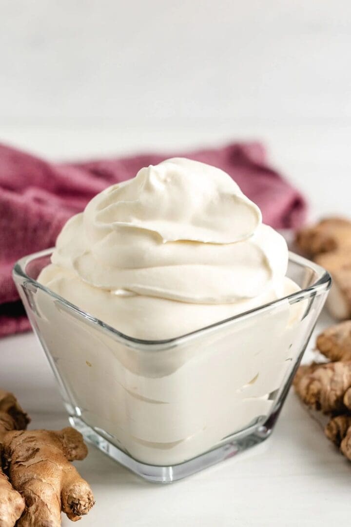 A bowl of Fresh Ginger Whipped Cream whipped cream with ginger in it.