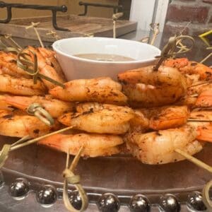 Grilled Chile-Lime Shrimp on skewers with dipping sauce.