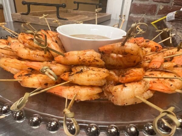 Grilled Chile-Lime Shrimp on skewers with dipping sauce.