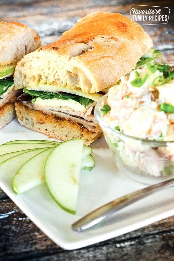 Two Stonewood Turkey Breast on a plate with a side of apple salad.