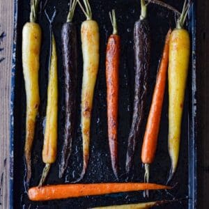 Roasted Tri Color Carrots on a baking sheet.