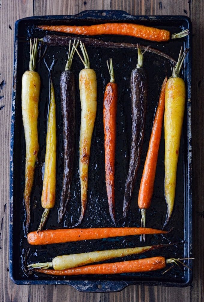 Roasted Tri Color Carrots on a baking sheet.