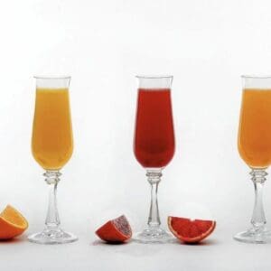 Three Mimosa Kits with orange slices in them.